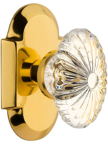 Arched Rosette Door Set with Oval Fluted-Crystal Glass Knobs in Polished Brass.
